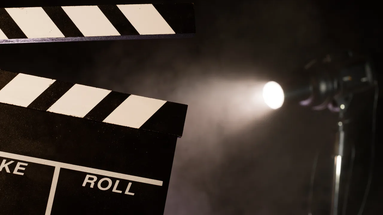 Film slate beside a studio spotlight