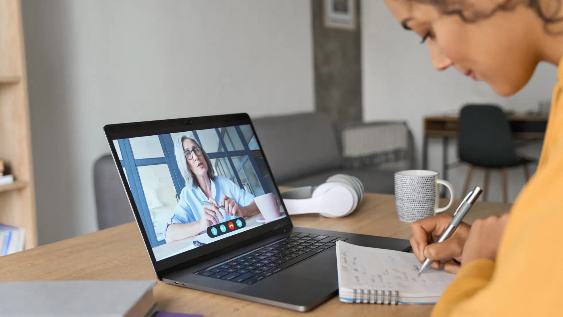 Person taking notes during a remote customer interview
