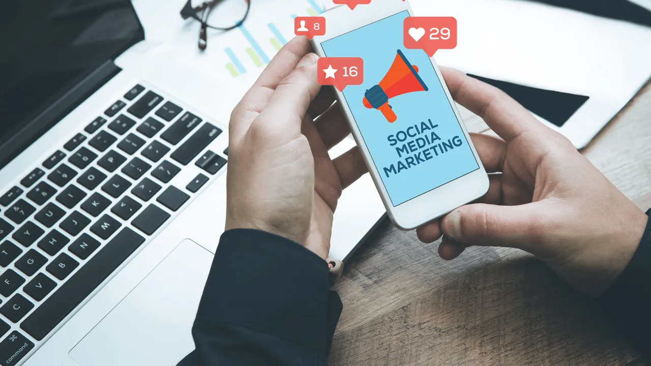 A marketer reviewing a digital marketing campaign on a smartphone