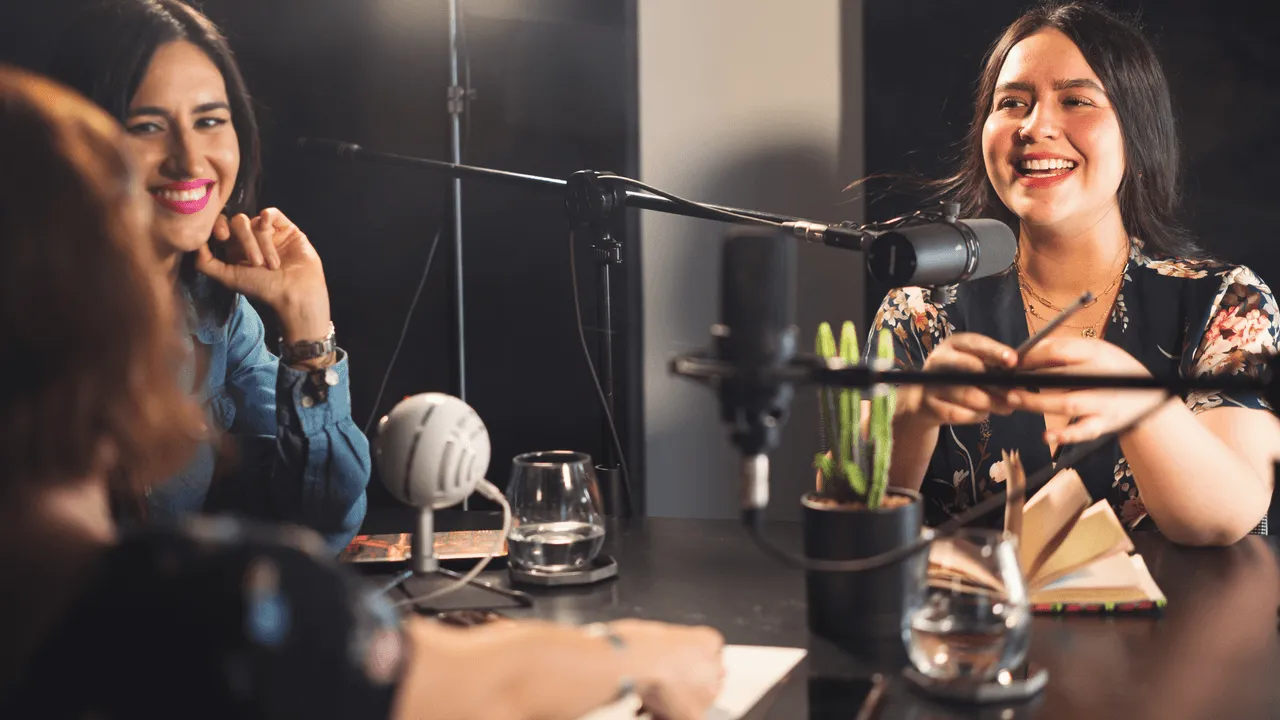 Two hosts recording a conversational podcast